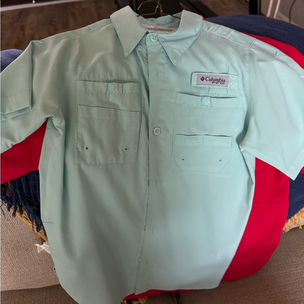 Three Columbia PFG fishing shirts. One red, two teal blue. Comes in a bundle